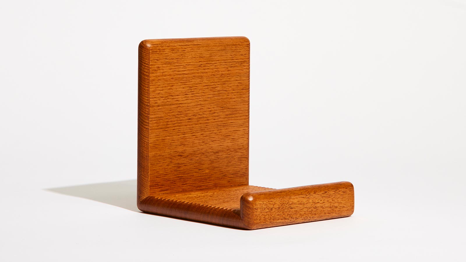 Sleek vinyl record stand with minimalist timber design 