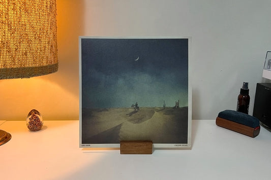 Monolith record stand displaying vinyl album “Lonesome Dreams” by Lord Huron